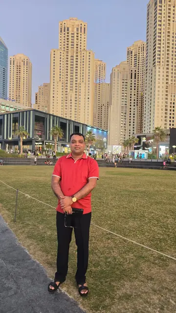 Abdul Kader Chowdhury in Dubai, in front of residential towers