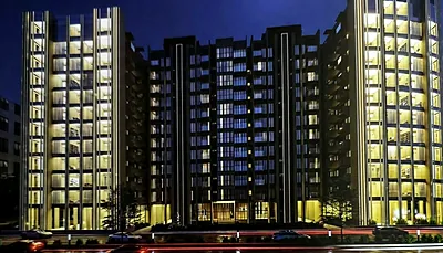 Inspiration image of residential towers lit up at night